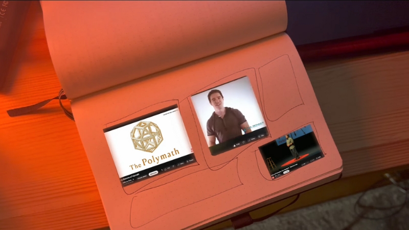 An image of a notebook with video clips on the page, symbolizing modern learning and the polymath mindset in today's world